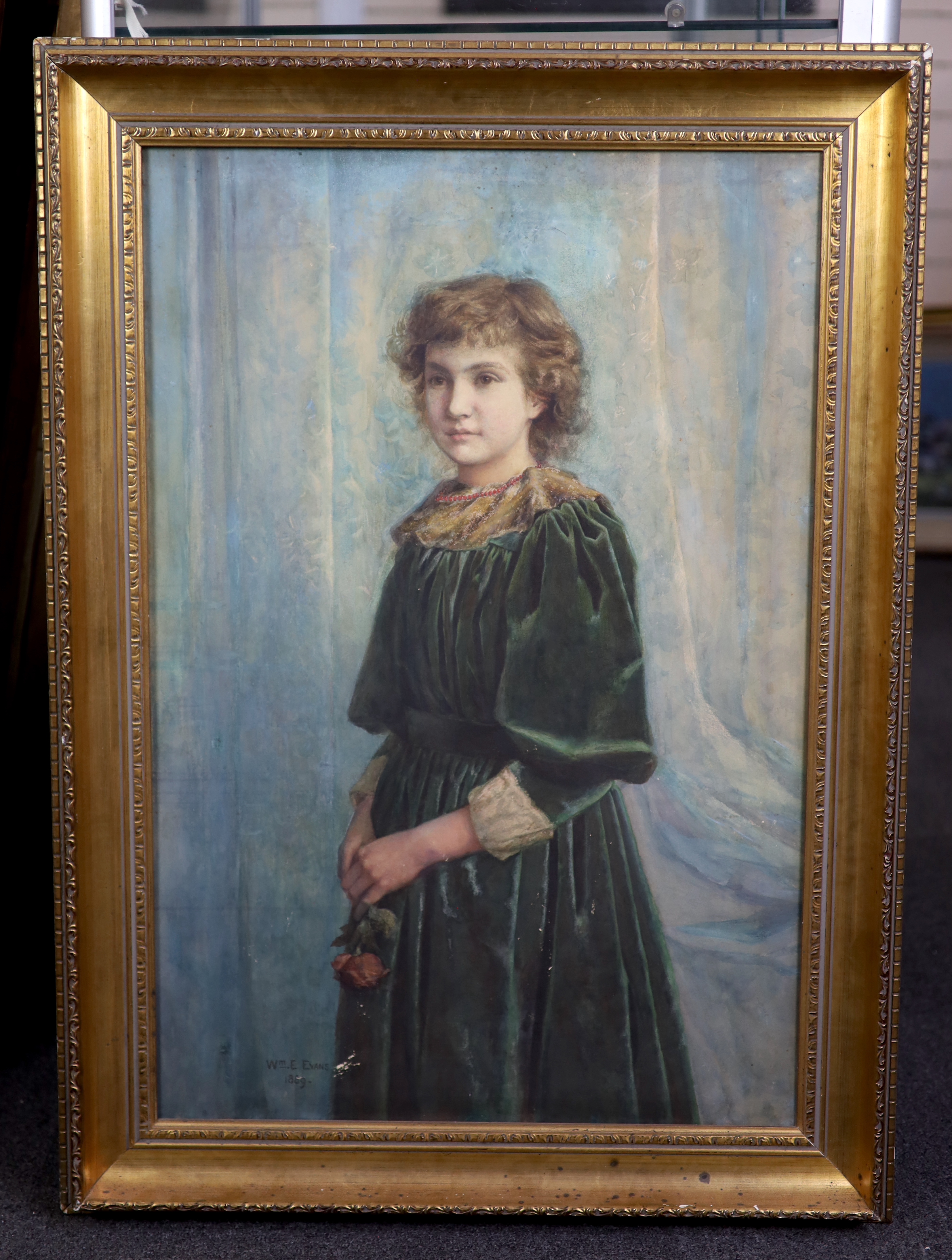 William E. Evans (d.1909), oil on board, Portrait of a girl holding a rose, signed and dated 1889, 75 x 49cm